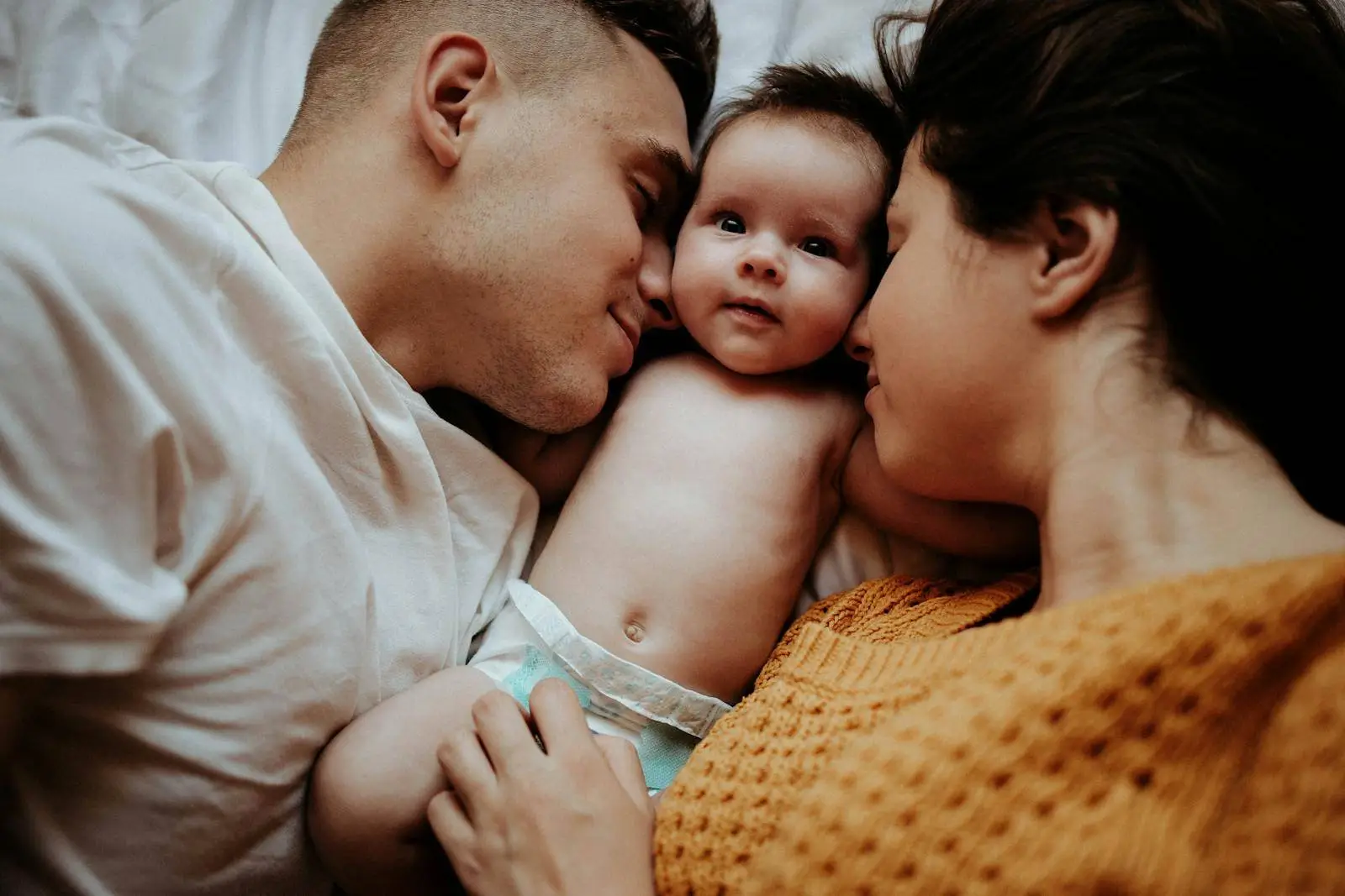 Intended parents with baby after completing their journey with EDSI, a California surrogacy agency offering transparent compensation guidance